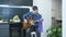 Handsome young musician play acoustic guitar and emotionally singing lyric song sitting on bar chair at home. Professional solo gu