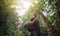 Handsome young stylish man in black t-shirt and sunglasses is engaged in trekking in the green jungle