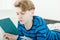 Handsome young teenage boy relaxing with a book