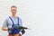 Handsome young working man with rotary hammer indoors. Home repair