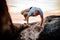 Handstand yoga pose by man on the beach near the ocean