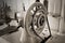 Handwheel old sewing machine. close up, horizontal, sepia, monoc