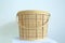 Handwoven bamboo basket with handle, traditional handicraft concept, container