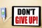 Handwriting Announcement text showing Don t Give Up. Business concept for Motivation Determination, Written on tablet with white b