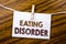 Handwriting Announcement text showing Eating Disorder. Business concept for Medical Problem written on sticky note paper on the wo