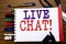 Handwriting Announcement text showing Live Chat . Business concept for Communication Livechat Written on notebook, wooden backgrou