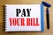 Handwriting Announcement text showing Pay Your Bill. Business concept for Payment for Goverment Written on notepad note paper back