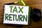 Handwriting Announcement text showing Tax Return. Business concept for Taxation Refund written on notebook book note paper on the