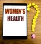 Handwriting Announcement text showing Women s Health. Business concept for Female Celebration Written on tablet with wooden backg