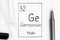 Handwriting chemical element Germanium Ge with black pen, test tube and pipette