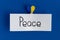 Handwriting inscription "peace" and clip in form of the heart in the colors of Ukrainian flag