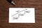 Handwriting stairs heading upwards with arrow on paper. Business success concept and growth idea.