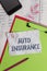 Handwriting text Auto Insurance. Concept meaning Protection against financial loss in case of accident Clipboard paper