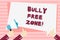 Handwriting text Bully Free Zone. Concept meaning creating abuse free school college life Hand Holding Megaphone and