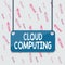 Handwriting text Cloud Computing. Concept meaning use a network of remote servers hosted on the Internet Board color background