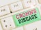 Handwriting text Crohn Disease. Concept meaning the chronic inflammatory disease of the intestines
