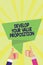 Handwriting text Develop Your Value Proposition. Concept meaning Prepare marketing strategy sales pitch Man woman hands thumbs up