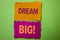 Handwriting text Dream Big. Concept meaning Motivation Plan Aim Dream Vision Strategy Challenge Idea written on Tear Papers on the