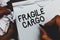 Handwriting text Fragile Cargo. Concept meaning Breakable Handle with Care Bubble Wrap Glass Hazardous Goods Man holding marker no