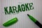 Handwriting text Karaoke. Concept meaning Entertainment singing along instrumental music played by a machine Linned paper backgrou