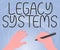 Handwriting text Legacy Systems. Word Written on old method technology computer system or application program