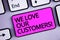 Handwriting text We Love Our Customers Call. Concept meaning Client deserves good service satisfaction respect Keyboard purple key