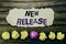 Handwriting text New Release . Concept for Technology Software Update Written on sticky note paper reminder, wooden background w