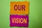 Handwriting text Our Vision. Concept meaning Innovation Strategy Mission Goal Plan Dream Aim Direction written on Tear Papers on t