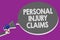 Handwriting text Personal Injury Claims. Concept meaning being hurt or injured inside work environment Man holding megaphone louds