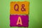 Handwriting text Q A. Concept meaning Ask Frequently Faq Asked Question Help Solving Doubt Query Support written on Tear Papers on