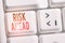 Handwriting text Risk Ahead. Concept meaning A probability or threat of damage, injury, liability, loss White pc keyboard with