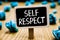 Handwriting text Self Respect. Concept meaning Pride and confidence in oneself Stand up for yourself Blackboard crumpled papers se