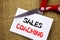 Handwriting text showing Sales Coaching. Conceptual photo Business Goal Achievement Mentoring written on Sticky Note Paper Cutting