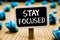 Handwriting text Stay Focused. Concept meaning Be attentive Concentrate Prioritize the task Avoid distractions Blackboard crumpled