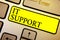 Handwriting text It Support. Concept meaning Lending help about information technologies and relative issues Keyboard yellow key I