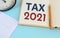 Handwriting text Tax 2021.Tax time 2021 concept, top view light blue background