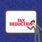 Handwriting text Tax Deduction. Word for amount subtracted from income before calculating tax owe
