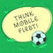 Handwriting text Think Mobile First. Concept meaning designing online experience for phones before web Soccer Ball on the Grass