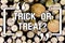 Handwriting text Trick Or Treat. Concept meaning Halloween tradition consisting in asking for sweets Wooden background