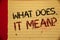 Handwriting text What Does It Mean Question. Concept meaning Confusion Curiosity Questioning Inquire Mellow yellow color page writ