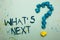 Handwriting text What s is Next. Concept meaning Asking whatever comes immediately after the present one Crumpled papers forming q