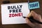 Handwriting text writing Bully Free Zone Motivational Call. Concept meaning creating abuse free school college life written by Man