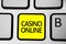 Handwriting text writing Casino Online. Concept meaning Computer Poker Game Gamble Royal Bet Lotto High Stakes Keyboard yellow key