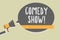 Handwriting text writing Comedy Show. Concept meaning Funny program Humorous Amusing medium of Entertainment Man holding megaphone