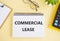 Handwriting text writing Commercial Lease. Concept meaning contract between a landlord and a business property tenants. Commercial