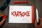 Handwriting text writing Karaoke. Concept meaning Entertainment singing along instrumental music played by a machine Googles glass