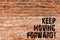 Handwriting text writing Keep Moving Forward. Concept meaning Optimism Progress Persevere Move Brick Wall art like