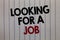 Handwriting text writing Looking For A Job. Concept meaning Unemployed seeking work Recruitment Human Resources white