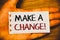 Handwriting text writing Make A Change Motivational Call. Concept meaning New Goals Opportunities Different Approach Text two Word