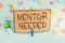 Handwriting text writing Mentor Needed. Concept meaning Employee training under senior assigned act as advisor Colored crumpled